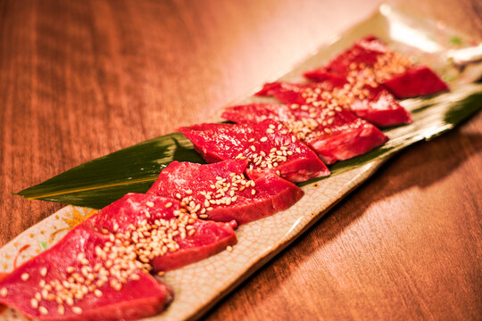 Sliced Beef Harami with Sesame on Long Ceramic Plate