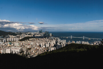 Busan city panorama beautiful skyline view from Hwangnyeongsan mountain observatory, Busan port, Gwangan bridge and harbor bay, South Korea, Yeongnam district, sunny day, travel to Republic of Korea
