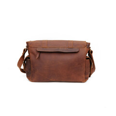 Matte tan leather sling bag, isolated on white background, perfect for leather product catalog design