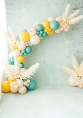 Balloon garland decoration with pampas grass and floral accents background