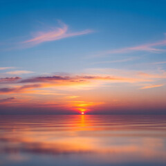 Fototapeta premium Stunning sunset paints the calm ocean with vibrant hues of orange and pink reflecting on the water's surface creating a serene and peaceful atmosphere.