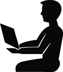 Silhouette of a person working on a laptop computer sitting down focused on digital technology and online tasks