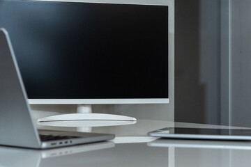 Fototapeta premium Modern and minimalist office workspace featuring essential digital tools for productivity and connectivity