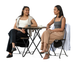 Two young Vietnamese women sitting in a cafeteria and talking, isolated on white and transparent background