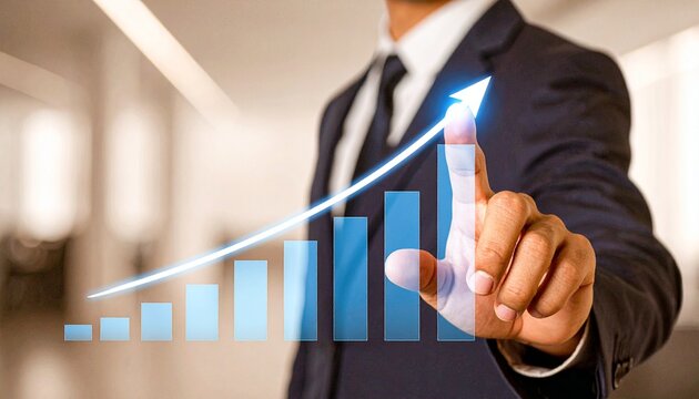 A businessman in a suit points to a rising graph, symbolizing growth and success in business.
