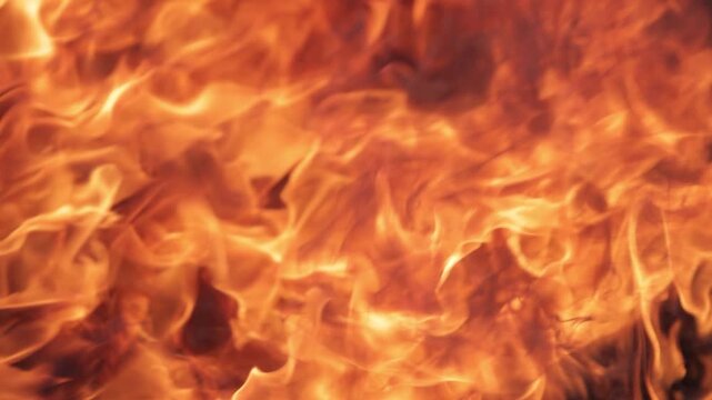 Close-up of raging flames captured in the aftermath of a fire, symbolizing destruction, danger, disaster, and the devastating impact of uncontrolled burning.