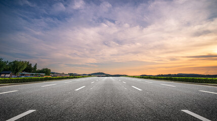 Serene Open Road at Dusk Surrounded by Nature