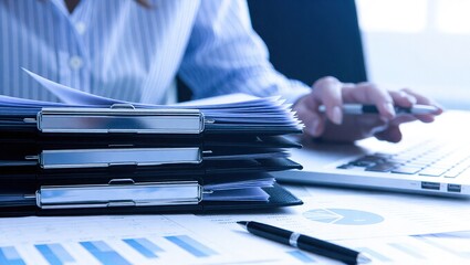 Business professional working with documents and technology.