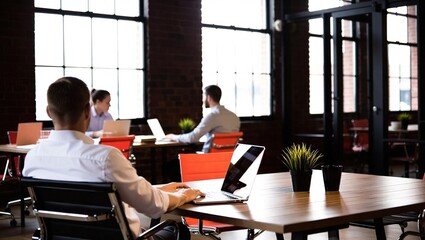 Business professionals working in a modern office space.