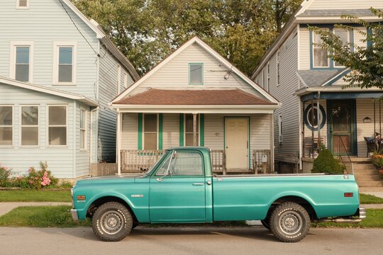 A turquoise vintage truck parked in the First Ward, Buffalo, New York