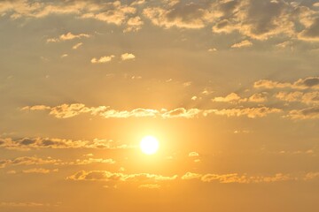 Morning haze sunrise partly cloudy sky replacement background orange glow with copy space.