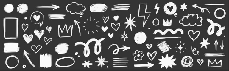 Collection of hand drawn white doodle elements on a dark background