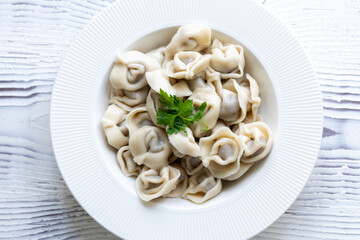 Close-Up of Pelmeni Dumplings on a White Plate
