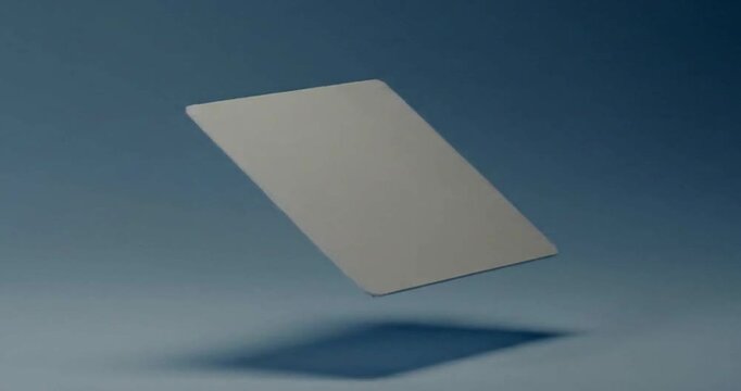 Minimalist Blank Gray Card Levitating and Rotating in Mid Air.