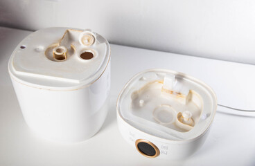 Chemical reaction and cleaning of home humidifier from hard water scale, close-up
