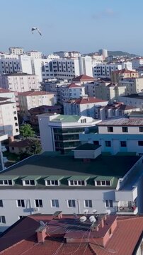 
Aerial drone footage showing a typical residential neighborhood in Istanbul, Turkey. Ordinary mid-rise buildings, urban life and birds flying over the city can be seen. Captured in LOG format and als