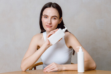 Young woman enjoying skincare routine with beauty products at home