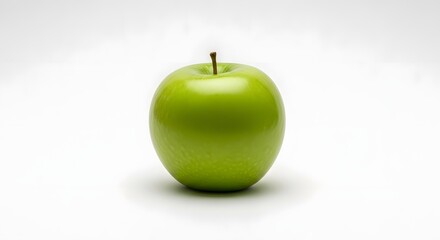 A single vibrant green apple with a stem stands isolated on a clean white background