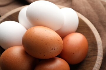 Fresh raw chicken eggs on table, closeup