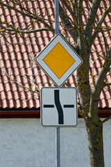 European Priority Road Sign Showing Main Road Straight with Side Roads Left and Right