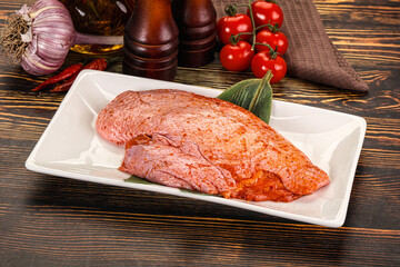 Raw marinated duck breast for cooking