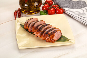 Sliced duck breast baked with cherry