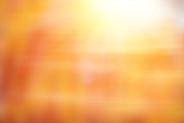 Abstract blurred orange and yellow background with bright sunlight and soft gradient effect. Warm glowing backdrop for design, summer mood, or creative projects