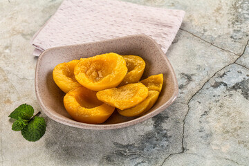 Canned marinated peach in syrop