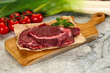 Raw beef cheeks cut for cooking