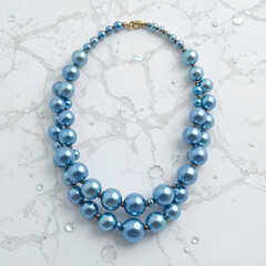 Obraz premium A stunning necklace of shimmering blue pearls, elegantly arranged and isolated on a pure white background.