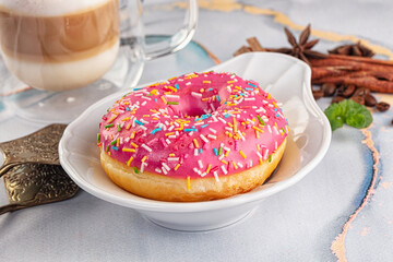 Sweet donut with strawberry icing