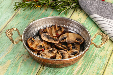 Tasty hot grilled champignon mushrooms