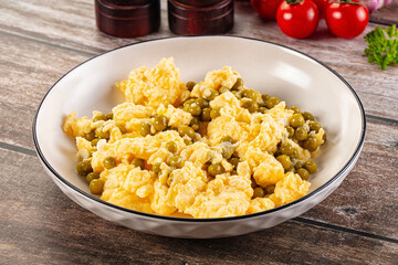 Scrambled egg omelet with green peas