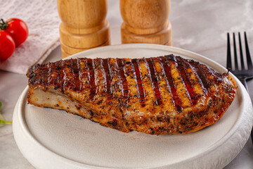 Grilled pork steak with bone