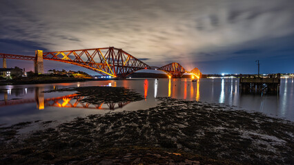Forth Bridge spanning Scotland's Firth of Forth at night