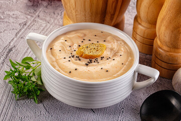 Tasty cheese cream soup with crouton