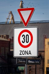 European Give Way Sign with Beginning of 30 km/h Speed Limit Zone