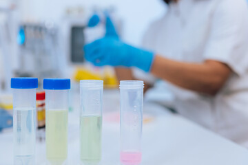 Transferring samples to microplate from multi channel pipette during scientific laboratory research. Medicine, and biotechnology concepts.
