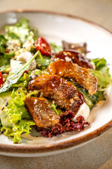 Closeup of gourmet salad with smoked eel and sesame