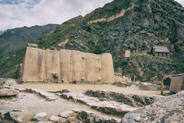 Temple del Sol or Sun Temple, a wall of six monoliths stone blocks at Ollantaytambo archaeological site, in the Sacred Valley of Peru