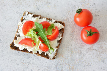 Healthy Tomato and Cheese Sandwich with Fresh Greens top view