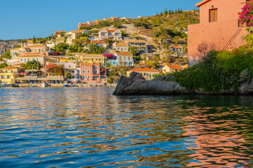 Assos Village Water View: Calm, Reflective Water in the Cove with Colorful Traditional Houses on the Hillside, Kefalonia