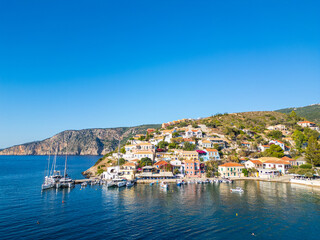 Assos greek Village. Wide View of Colorful Houses, Yachts in the Harbor, and Cliffs on the Kefalonia Coast