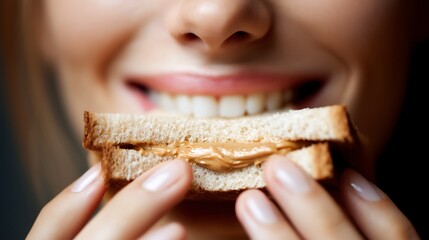 Close-up of Smiling Woman Holding Sandwich with Nut Butter in Bright Kitchen