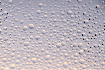 Macro Water Drops on Glass. Blue Condensation