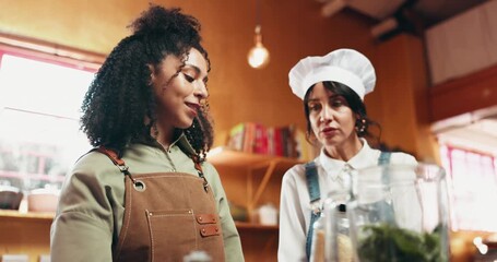 Cooking, women and chef with advice, kitchen or smile for olive oil measurements, talk and meal prep. People, culinary skills and help for intern with ingredient, learning and mentor with recipe tips