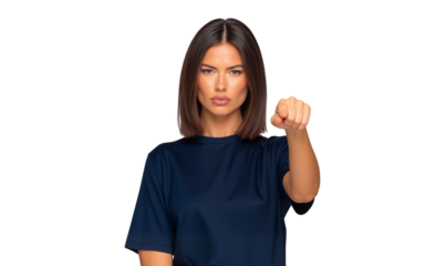 Angry woman makes a fist towards the camera, conveying determination and challenge