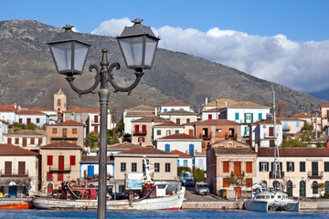 Galaksidi town, panoramic view of the old, traditional town in central Greece at the background, with an old, rusty lamp post in the foreground.
