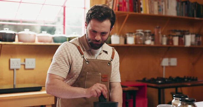 Cooking, man and tablet with mortar in home to grind herbs, online recipe or hospitality industry. Private chef, tech or crush ingredients in kitchen for meal prep, personalized menu and web tutorial