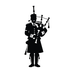 Obraz premium Silhouette of a bagpiper in traditional scottish attire playing bagpipes